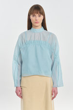 Light blue translucent silk blouse