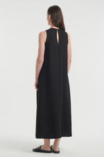 Black sleeveless dress with pleats