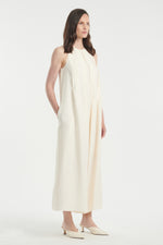 Light ivory sleeveless dress with pleats