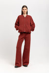 Dark brick technical wool jersey relaxed pants