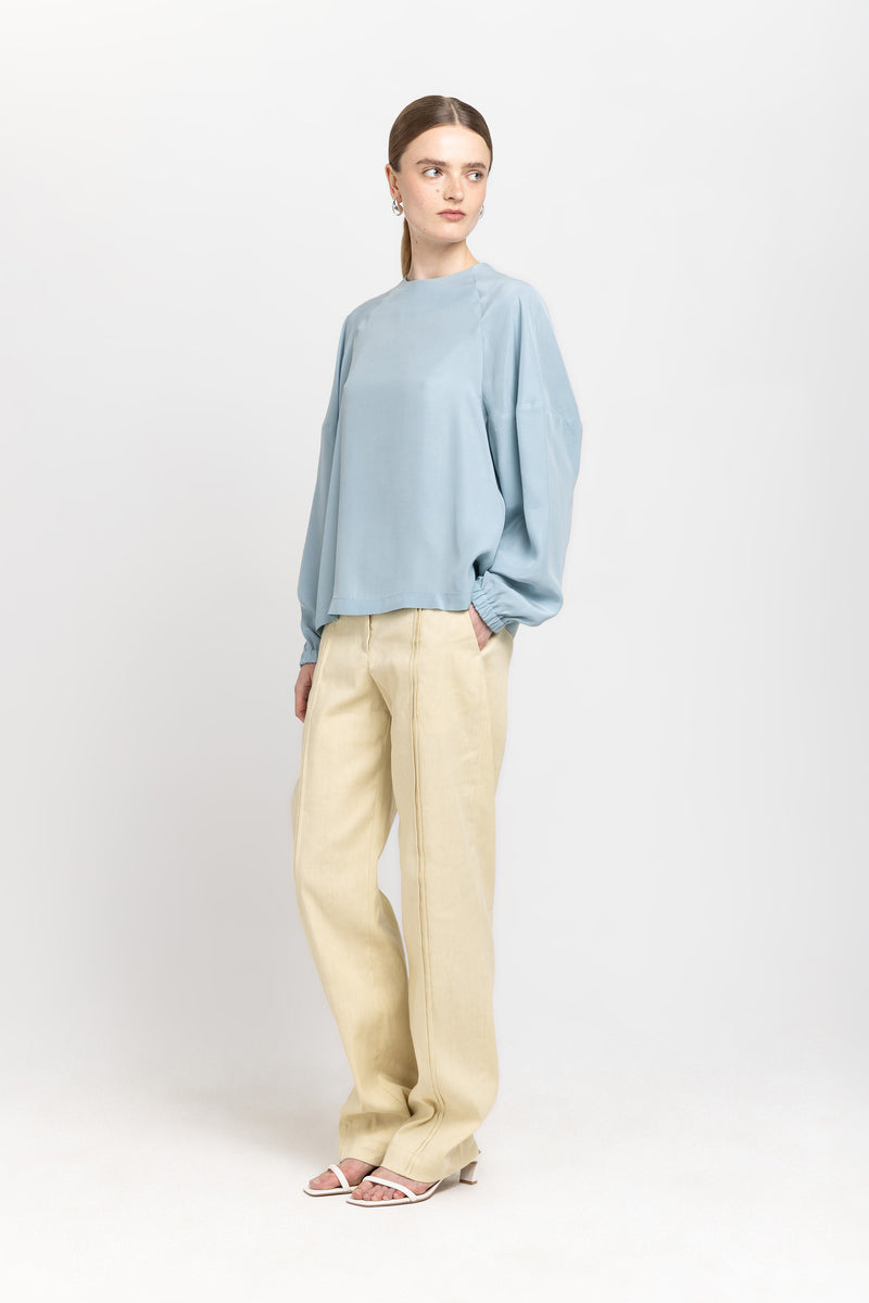 Light blue fluid lyocell blouse with shaped sleeves