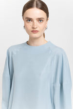 Light blue fluid lyocell blouse with shaped sleeves