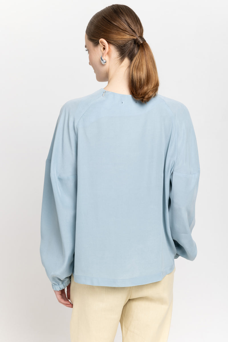 Light blue fluid lyocell blouse with shaped sleeves
