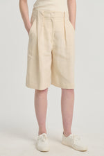 Ivory linen shorts with pleats